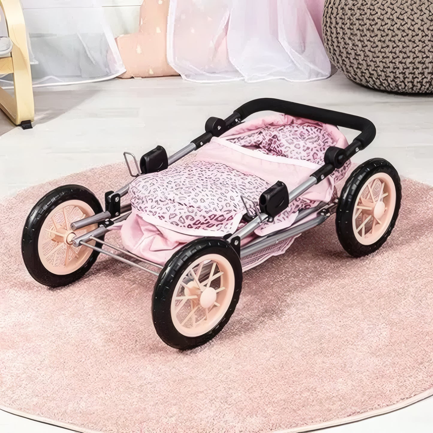 Pink leopard print stroller with wheels on a pink rug
