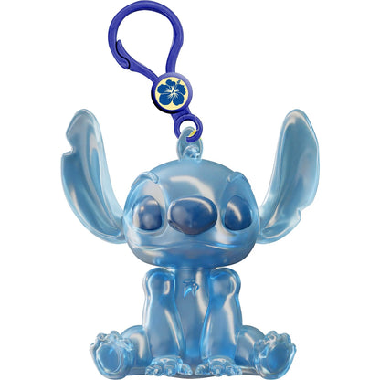A translucent light blue Disney Stitch keychain figure with a dark blue clip and a blue flower emblem, shown on a plain white background.