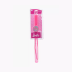 A pink Barbie-branded wand or stick-shaped accessory in clear retail packaging with a pink card label, shown on a plain light gray background.