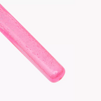 A close-up of a bright pink textured stick, likely a lip gloss stick or cosmetic applicator, shown diagonally on a plain white background.