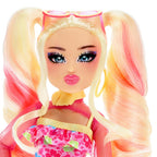 Toy doll with blonde hair in pigtails, colorful outfit, and sunglasses on a white background