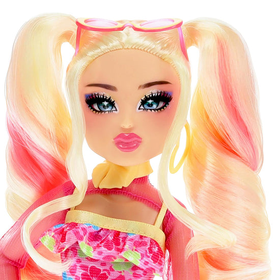 Toy doll with blonde hair in pigtails, colorful outfit, and sunglasses on a white background