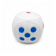 A white silicone stress toy dice cube with blue and red dots, photographed on a clean white background.